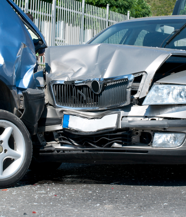 Accident investigator examining crash scene