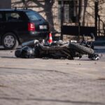 Crashed motorcycle on the road after an accident